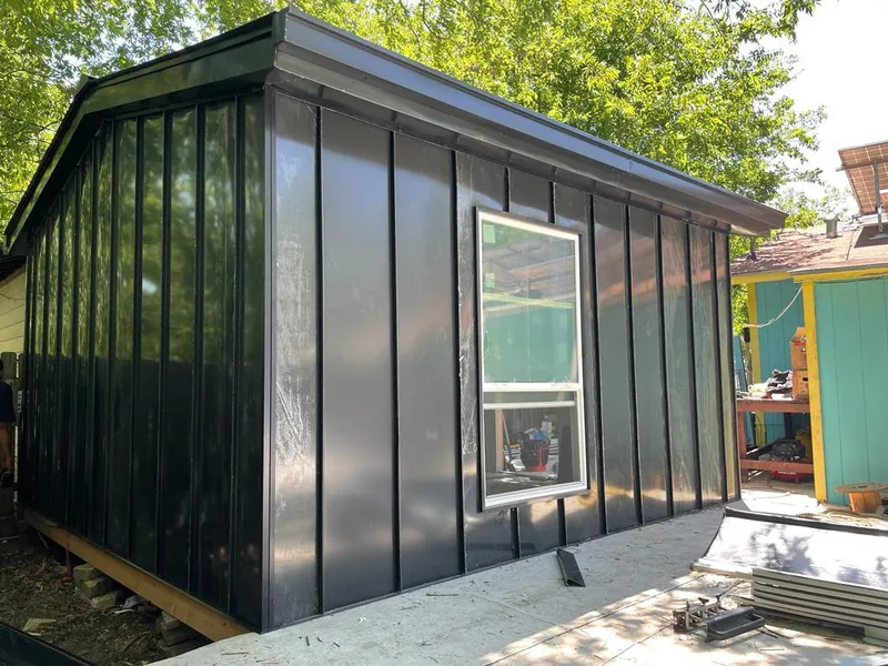 Black standing seam metal wall panels for Roof Inspection in The Woodlands